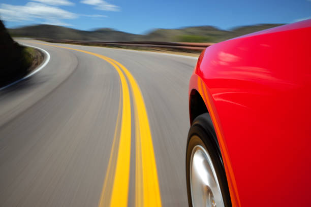 istock Mountain Road Speeding Car. 157675796