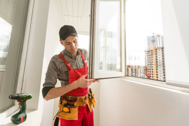 istock Young woman wearing helmet using power drill and tools for work at home, installing windows. Girl working at flat remodeling. Building, repair and renovation. 1576758075