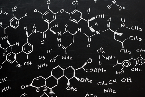 blackboard full of chemical formula