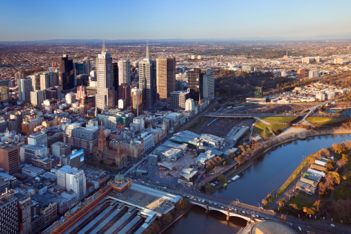The Melbourne CBD with Flinders Street Station in the foreground. Photographed at sunset.