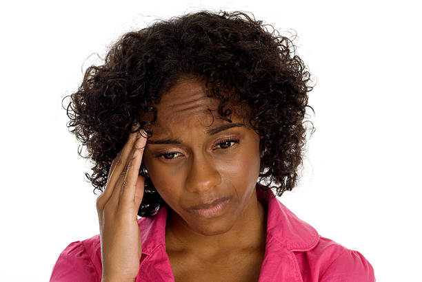 istock Woman holding her head 157676215