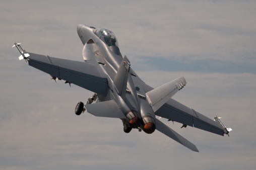  F-18 Hornet, modern combat airplane taking off.