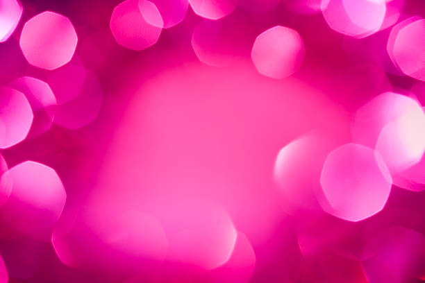 Defocused pink lights. Christmas decoration with copy space