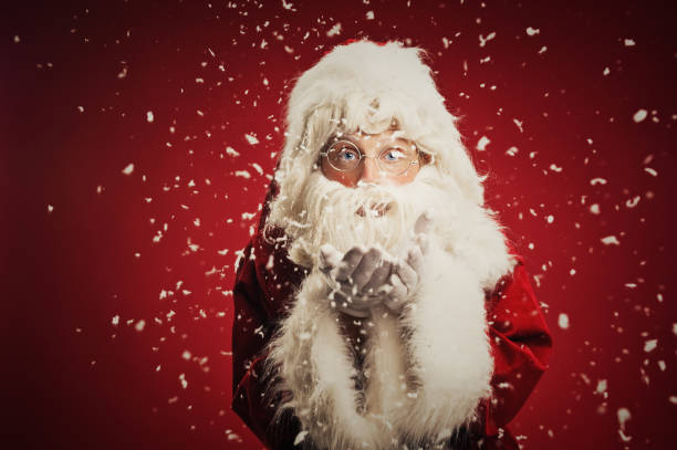 istock Happy Santa Claus in snow 157676589