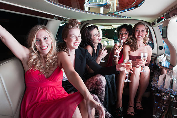 istock Five girls in a limo drinking and partying 157676750