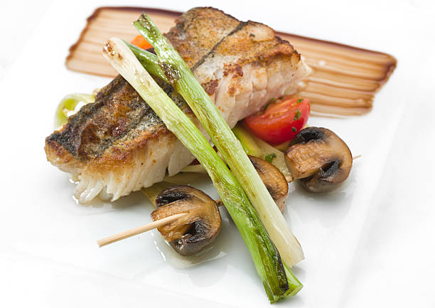 Saute fillet of Hake (merluza) with mushrooms  merluza stock pictures, royalty-free photos & images