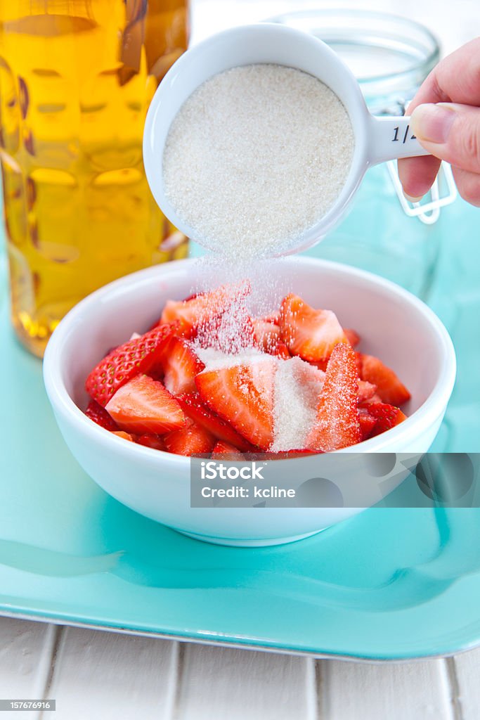 Pouring Sugar on Berries  Preserves Stock Photo