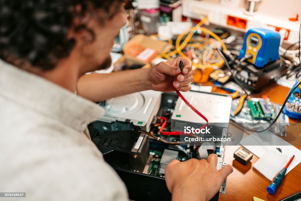 Technician Connecting Cable Into A Computer Unit Stock Photo - Download ...