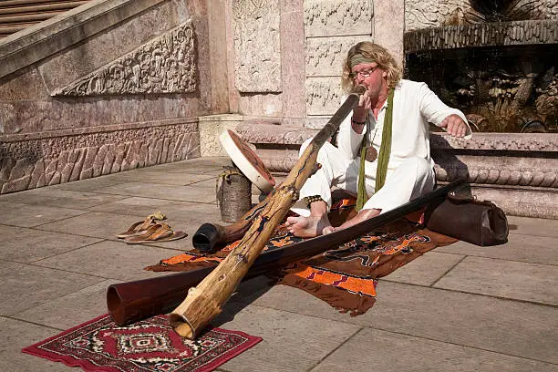 Didgeridoo player in historic ambience