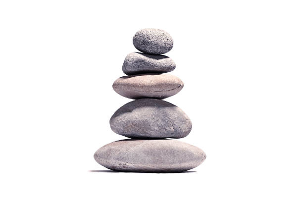 Stack of volcanic pebbles isotaded on white with clipping path Stack of volcanic pebbles isotaded on white with clipping path buddhism stock pictures, royalty-free photos & images