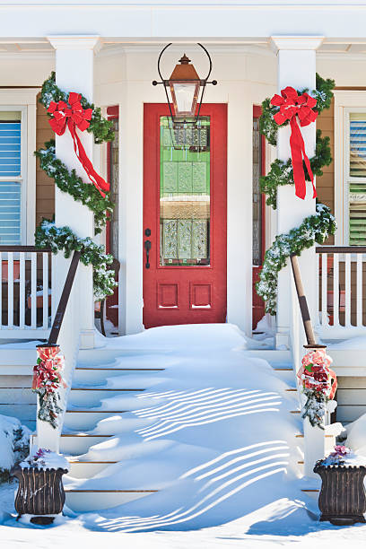 istock inviting front doorway with snowy Chrismas porch 157677109