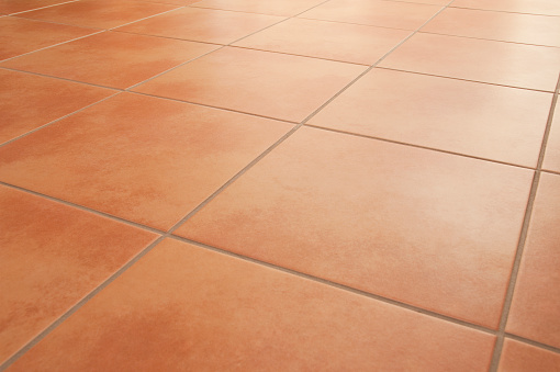Shiny and neat italian style ceramic floor tiles, diagonal, selective focus.