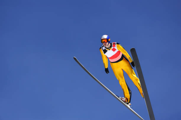 istock Ski jumper against the blue sky 157677143