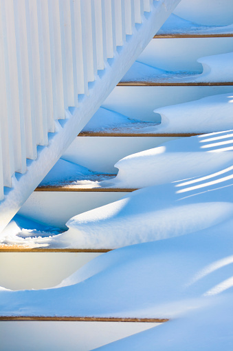 snow on porch stairs