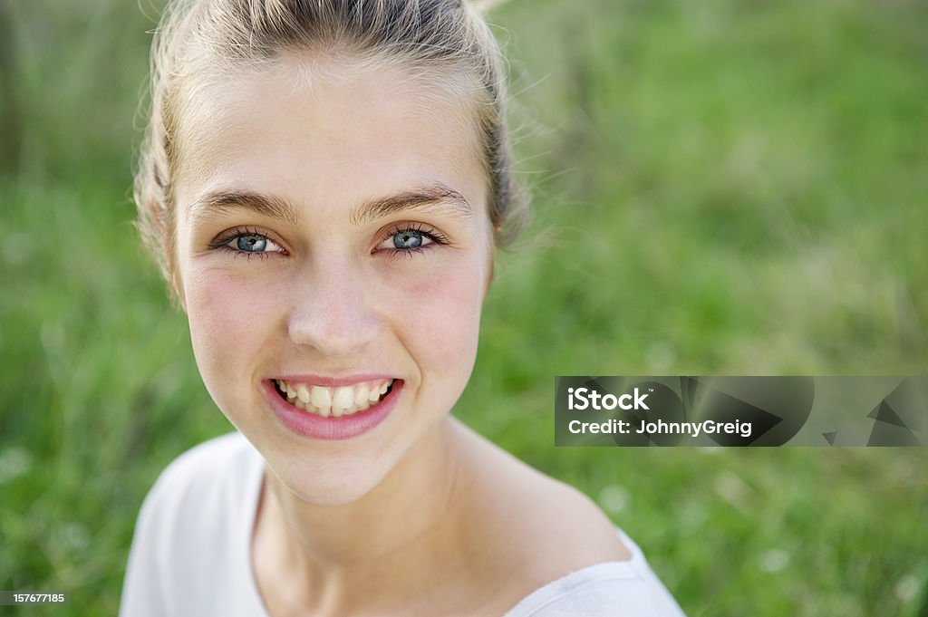 Outdoor portrait of pretty smiling teenage girl.  Teenage Girls Stock Photo