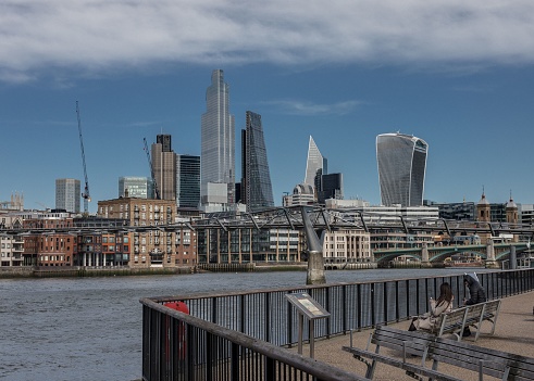 London, United Kingdom – February 16, 2022: An view of London featuring a vibrant skyline of buildings and a tranquil river running through the city