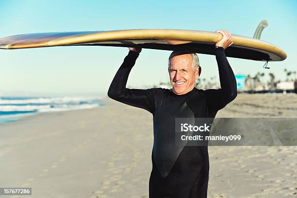 Senior Surfer Holding Surfboard On Head Stock Photo - Download Image Now - 60-64 Years, 65-69 Years, Active Lifestyle