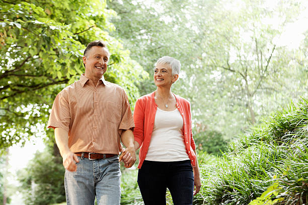 istock Senior Couple Holding Hands Outdoors 157677319