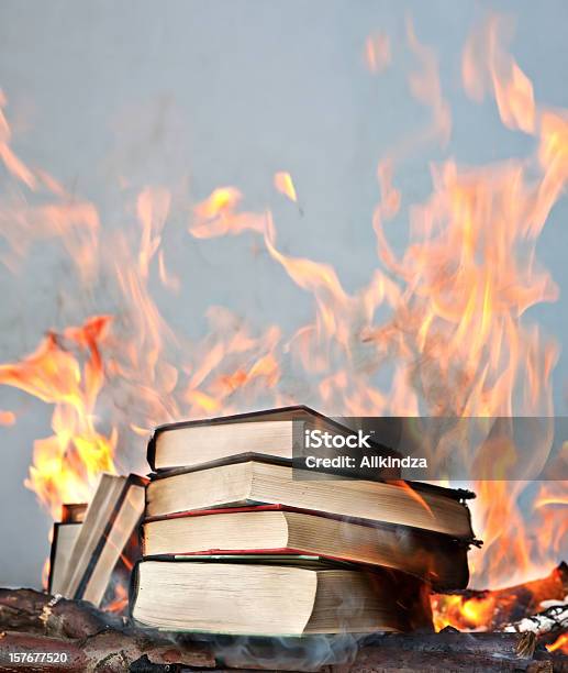 Short Stack Of Books Ablaze Stock Photo - Download Image Now - Book, Forbidden, Censorship