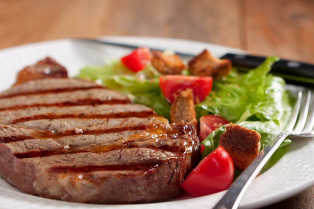 istock Plate of grilled steak and side salad 157677695