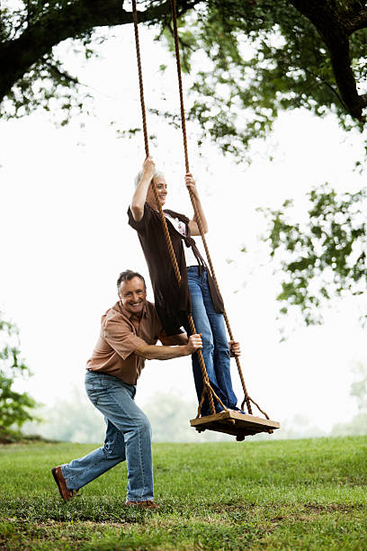 istock Senior Couple Playing on a Swing 157678032