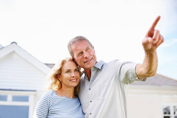 istock Senior man with a woman pointing at something interesting 157678276