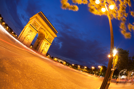 Arc De Triomphe at night in Paris, France, fisheye lens