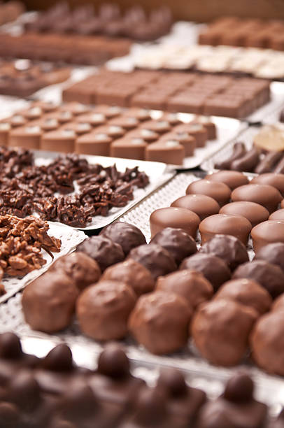 Assorted chocolate pralines in a Swiss confiserie stock photo
