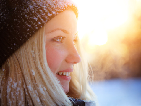 winter portrait of happy  beautiful young blonde woman 