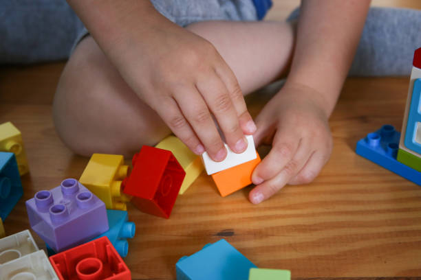 istock child plays constructor. Motor skills, logic, creativity, games for children 1576784830