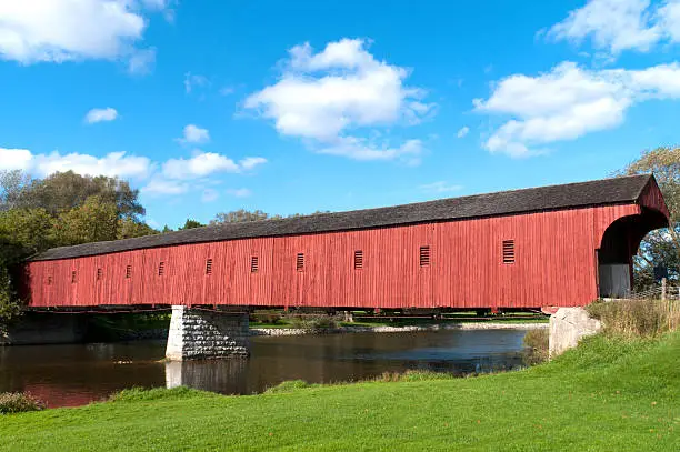 The West Montose Covered Bridge (Kissing Bridge) near Waterloo is the last covered bridge in Ontario, Canada. (Modern elements like electricity transmission lines painstakingly removed)