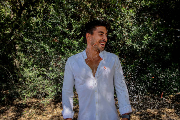 istock Young man wet at the park 1576786967
