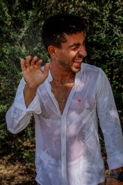 istock Young man wet at the park 1576786977