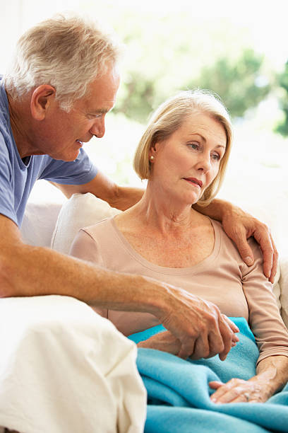 istock Husband Comforting Senior Woman Feeling Unwell 157679119