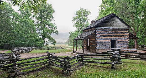 Pioneer Log Cabin with Split Rail Fence John Oliver's place in Cades Cove, in the Great Smoky Mountains. rail fence stock pictures, royalty-free photos & images