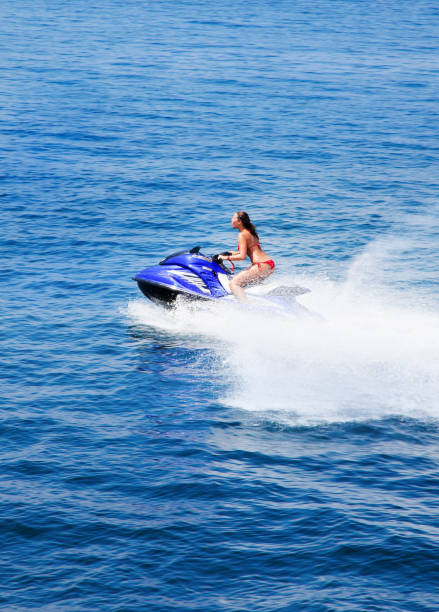 istock Beautiful woman riding a sky-jet 157679278