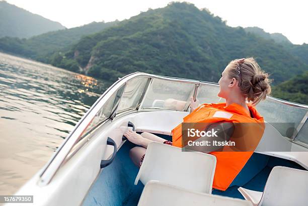 Woman Riding The Boat Stock Photo - Download Image Now - Life Jacket, Sailing, Motorboat