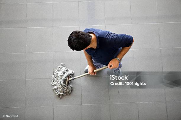 Man Cleaning The Floor Stock Photo - Download Image Now - 30-39 Years, Adult, Adults Only