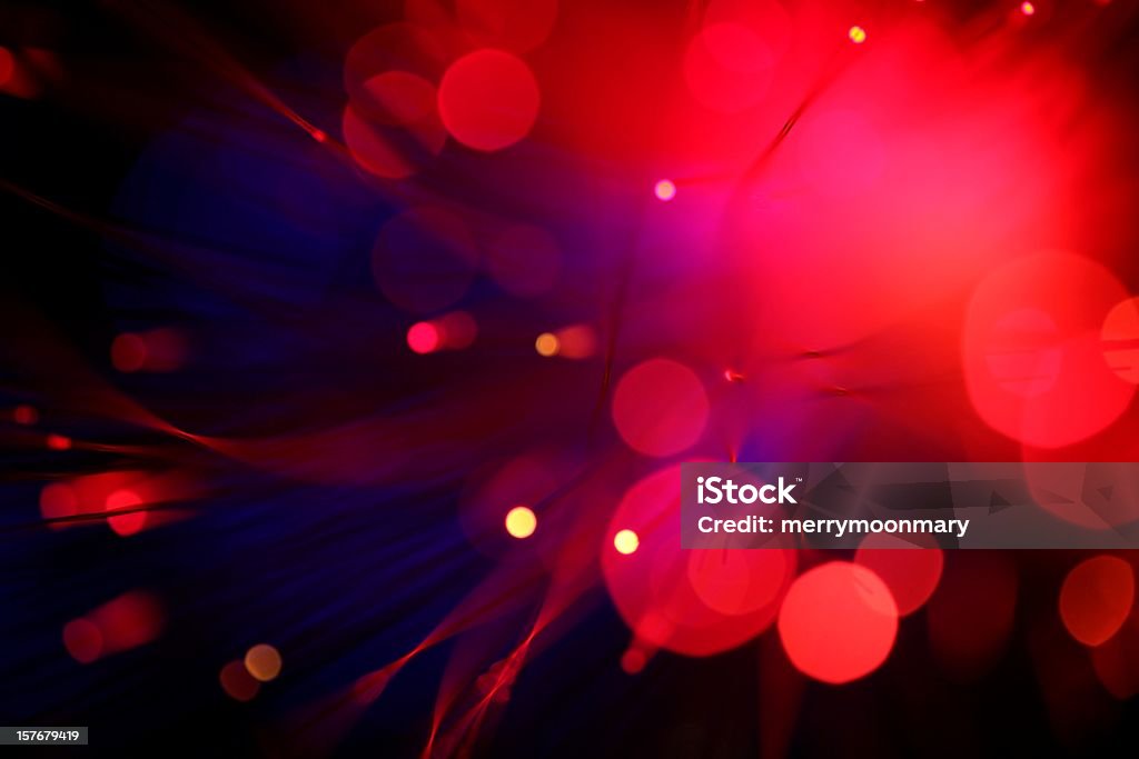 Blurred view of red lights small and large XXXL photo - actual photo with no post procuction manipulation, glowing defocussed light points to highlight text with an abstract technology/nightlife background. Red Stock Photo