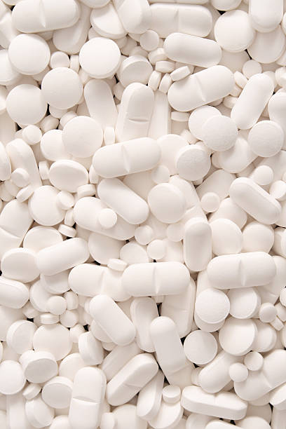 White pills background stock photo