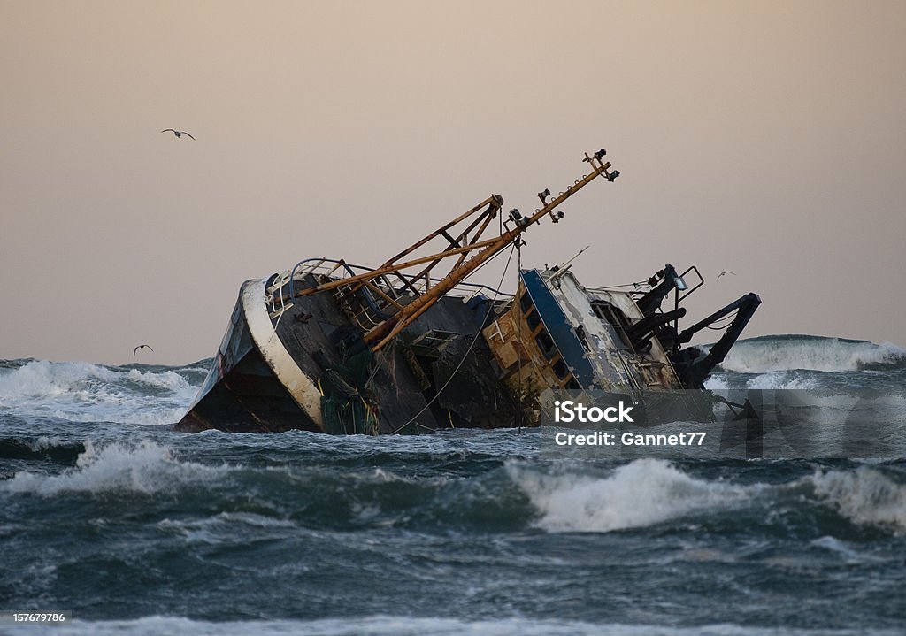 Fishing vessel boat aground on sea A fishing vessel run aground near Fraserburgh, Scotland Shipwreck Stock Photo