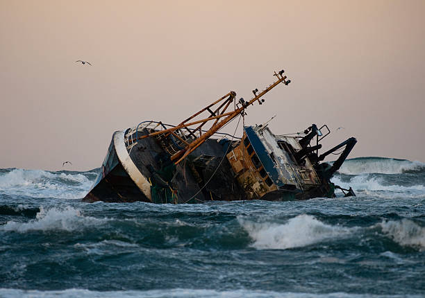 Fishing vessel boat aground on sea A fishing vessel run aground near Fraserburgh, Scotland stranded stock pictures, royalty-free photos & images