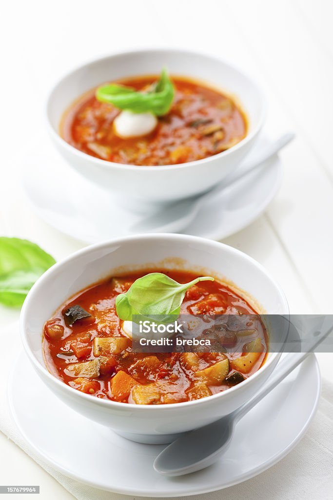 Minestrone soup Homemade delicious minestrone soup with mozzarella and basil Appetizer Stock Photo