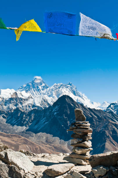 istock Everest framed colorful Buddhist prayer flags stone cairn Himalayas Nepal 157680215