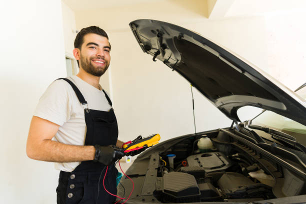 istock Happy car mechanic working in auto shop 1576802189