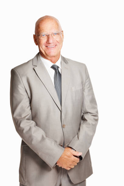 istock An elderly business man standing against white background 157680319