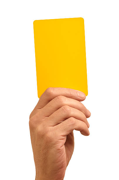 Hand holding bright yellow card against white background stock photo
