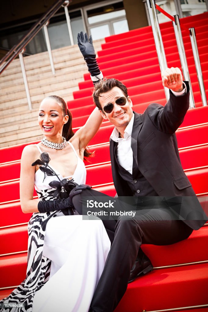 Celebrity couple on red carpet in Cannes Celebrity couple on red carpet in Cannes. Taken on event iStockalypse Cannes 2010. Dress Stock Photo