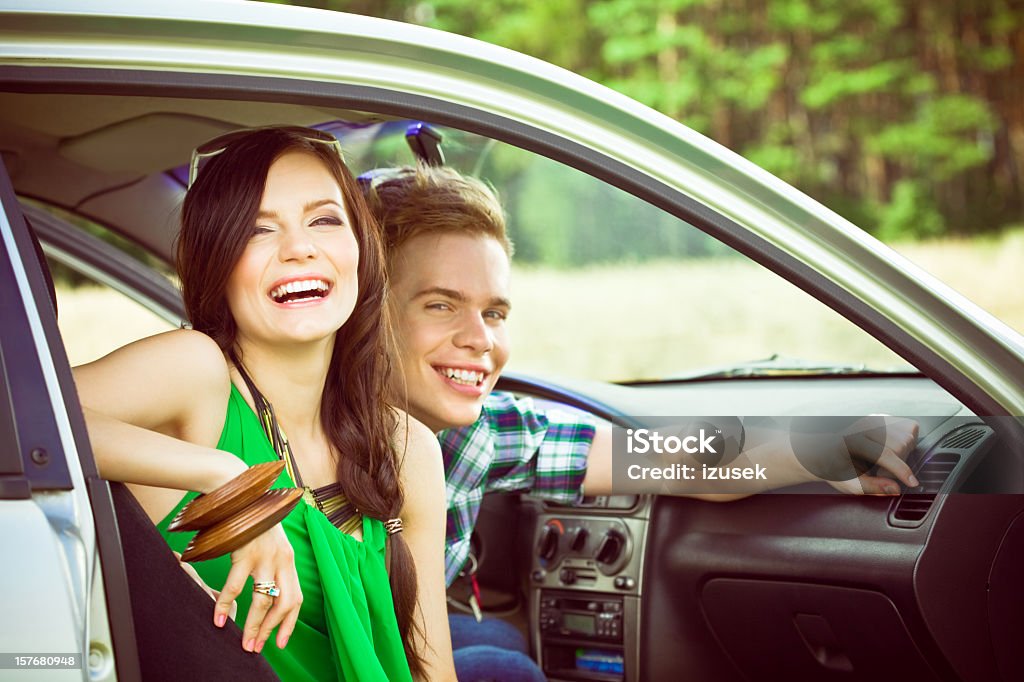 Happy young couple in a car  Car Stock Photo