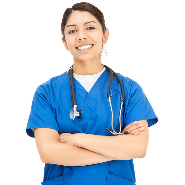 alegre joven hispana enfermera en azul exfoliaciones - female nurse fotografías e imágenes de stock